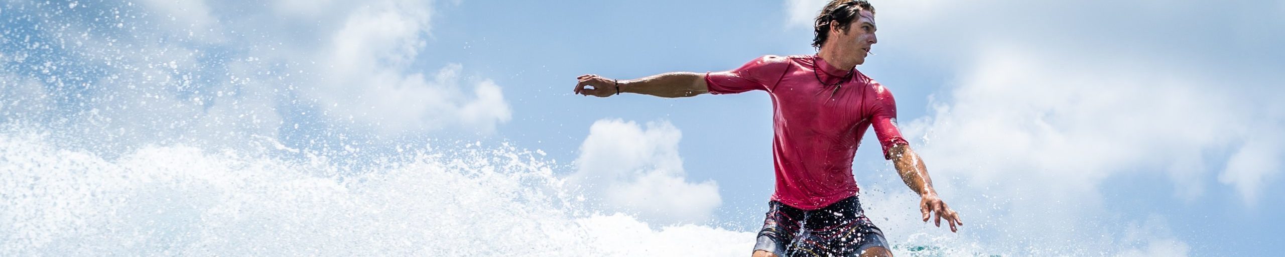 Surfer,Rides,The,Wave,At,Sunny,Day